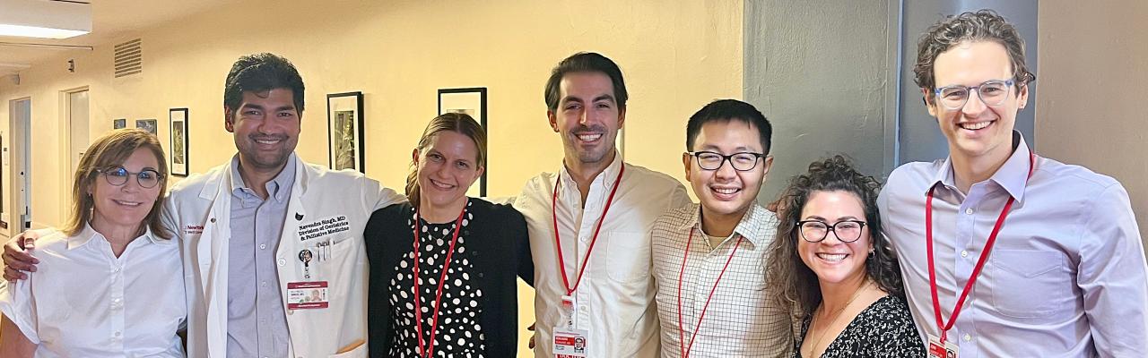 Geriatrics and Palliative Medicine fellow physicians smiling together with members of the Division's medical education team.