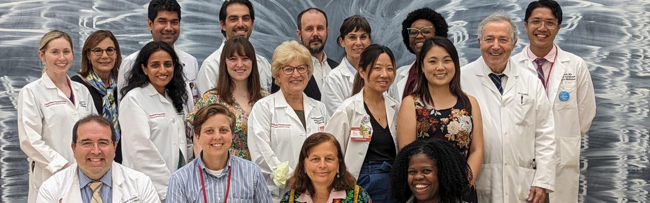 Interdisciplinary Palliative Care team members pose for a group photo.