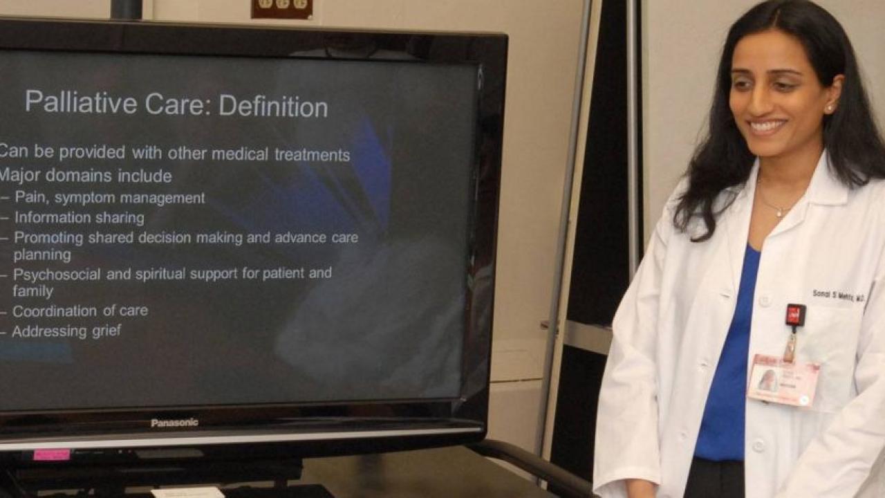 Dr. Mehta presents a slide on Palliative Care