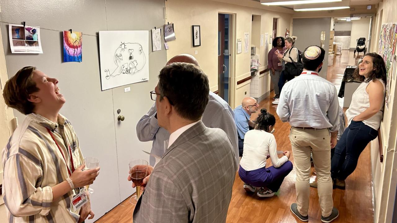 guests discuss art at Baker Louvre event