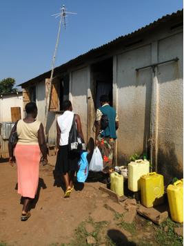 the three palliative care team members arrive at the front door of a home