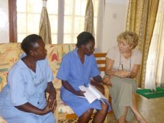 Dr. Diamond discusses a case with two members of the Naggalama Hospital staff in Uganda.